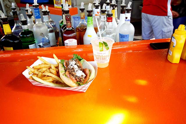 Grab some quality food by the pool, and just steps from the ocean, at the Caribbean Pool Bar and Grill