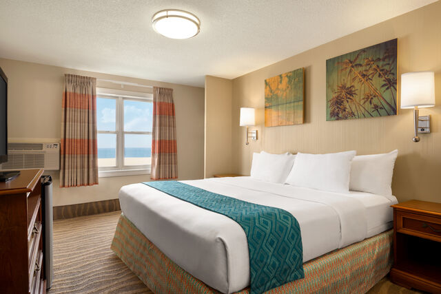 Enjoy scenic views of the Ocean City boardwalk and wide beach from this Oceanfront King Room.